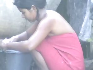 wow... outstanding desi village gal bathing outside