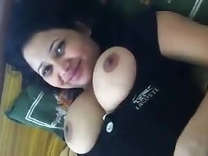 Big tittied Oriental woman reveals her beauties